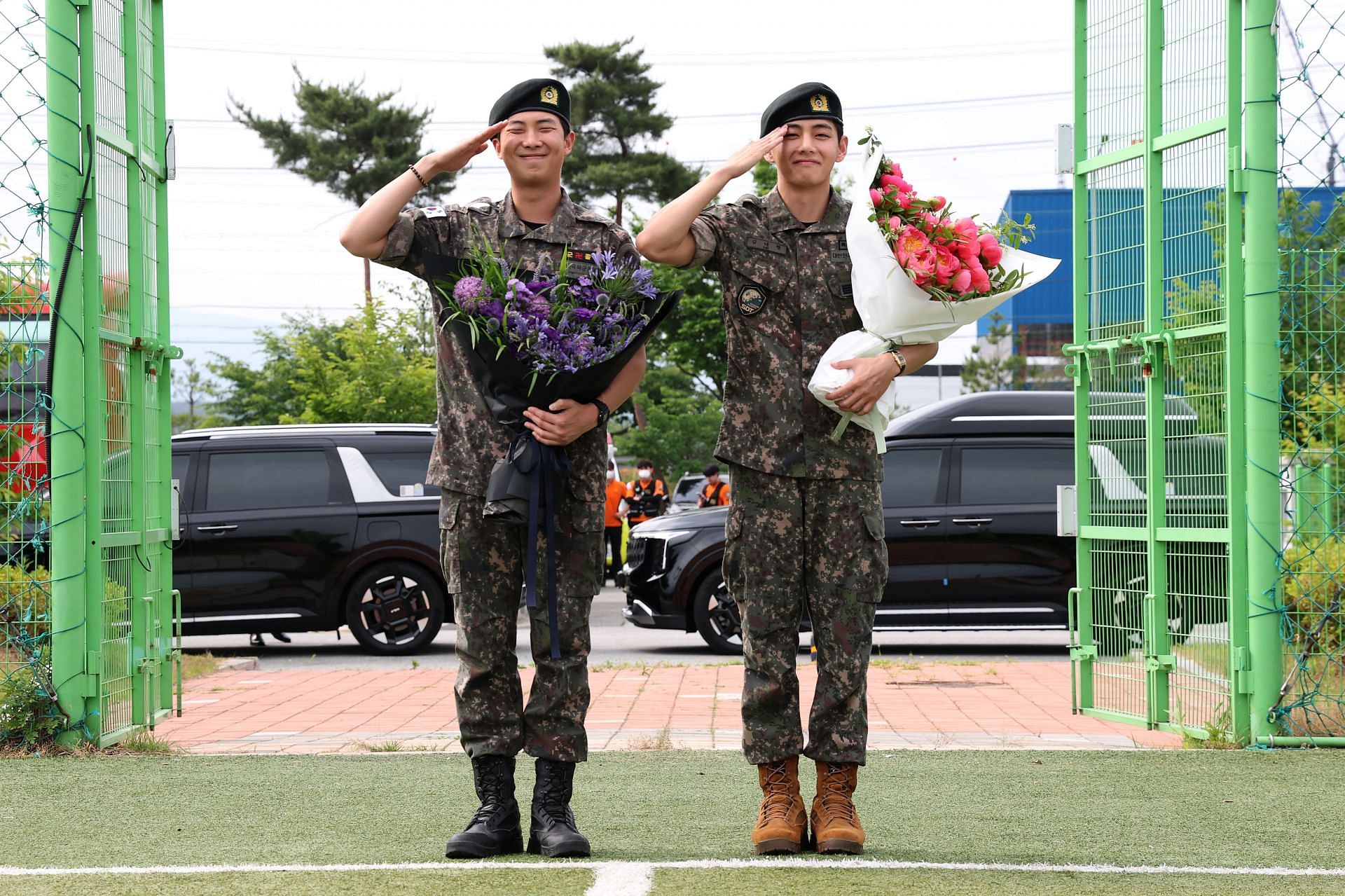 BTS members RM (L) and V (R) were discharged from military on June 10, 2025 in Chuncheon, South Korea. (Image via Getty)